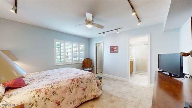 bedroom featuring ceiling fan, ensuite bathroom, and rail lighting