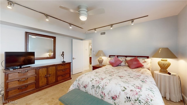 bedroom featuring track lighting and ceiling fan