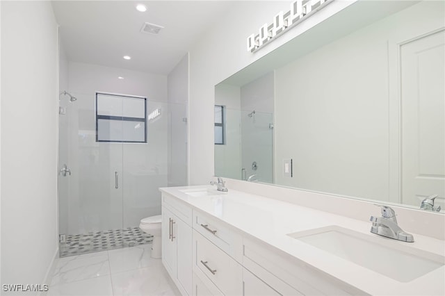 bathroom with toilet, an enclosed shower, and vanity