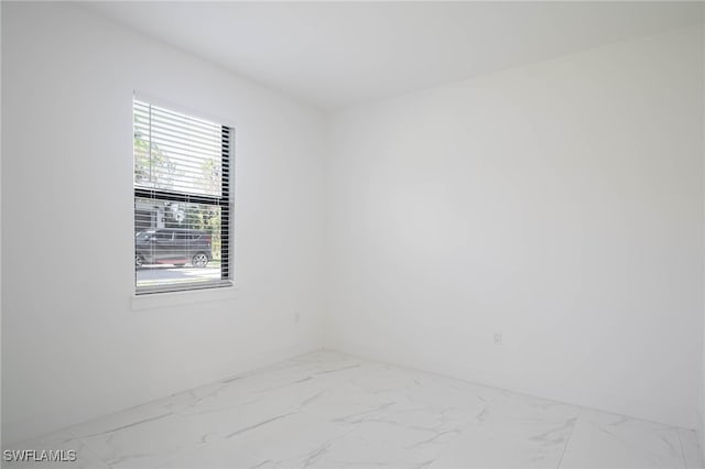 2844 37th Ave NE, Naples, FL 34120 - unfurnished room featuring marble finish floors