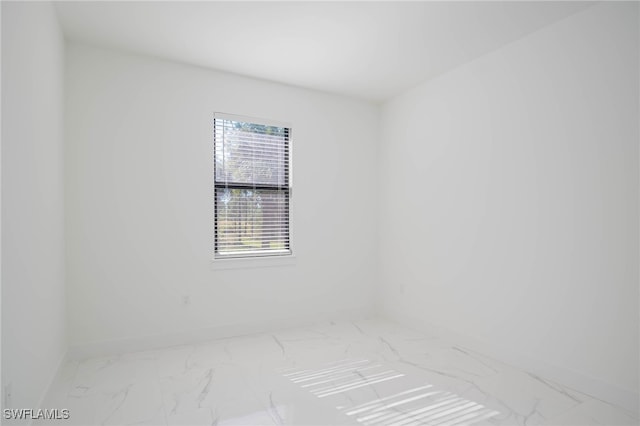 2844 37th Ave NE, Naples, FL 34120 - unfurnished room with marble finish flooring
