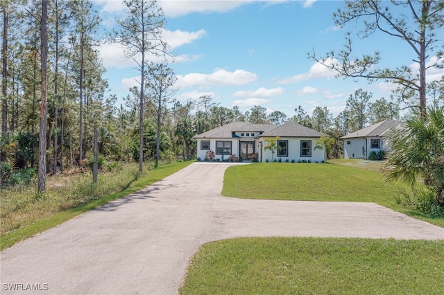 2844 37th Ave NE, Naples, FL 34120 - view of front of home with driveway and a front yard