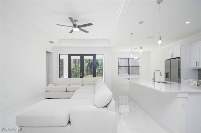 2844 37th Ave NE, Naples, FL 34120 - living room with light marble finish floors, crown molding, a raised ceiling, ceiling fan, and recessed lighting