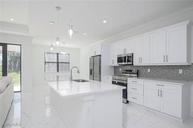 2844 37th Ave NE, Naples, FL 34120 - kitchen with appliances with stainless steel finishes, light marble finish floors, ornamental molding, tasteful backsplash, and a kitchen island with sink
