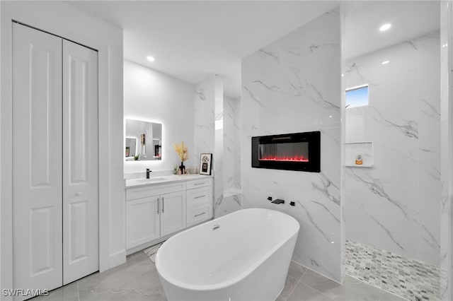 bathroom featuring vanity, plus walk in shower, tile walls, and a high end fireplace