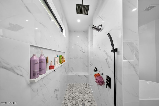 bathroom featuring tiled shower