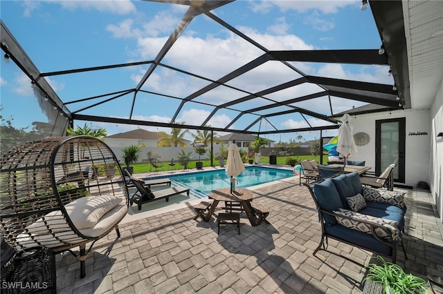 view of patio / terrace with a lanai, outdoor lounge area, and a fenced in pool