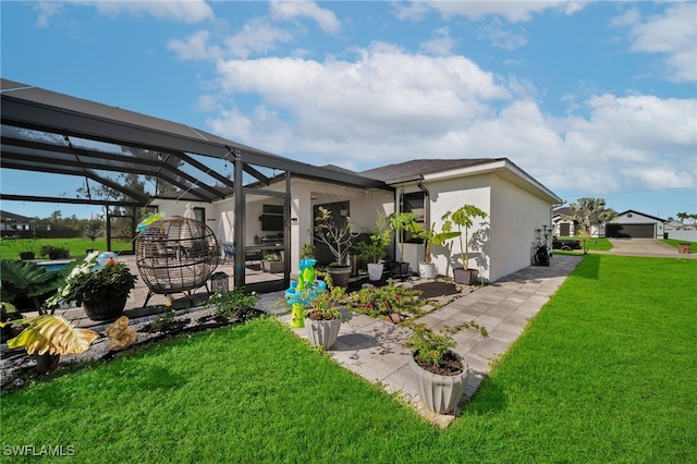 back of house with a lawn and glass enclosure