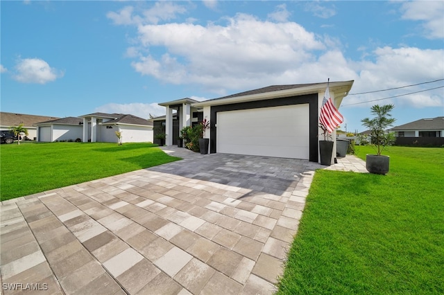 view of front of home featuring a garage and a front lawn