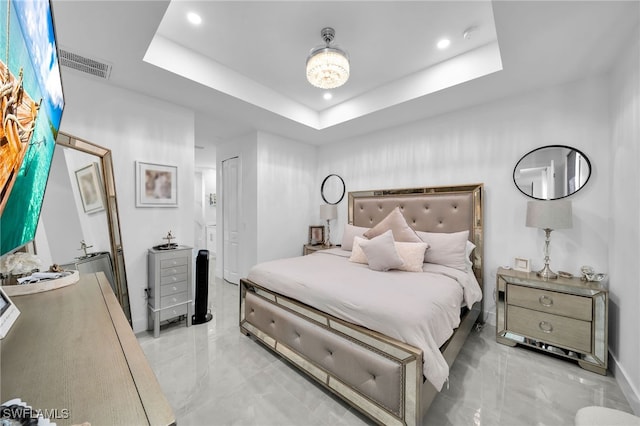 bedroom featuring a raised ceiling