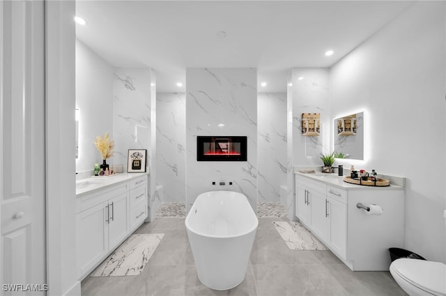 bathroom with vanity, shower with separate bathtub, a premium fireplace, and tile walls