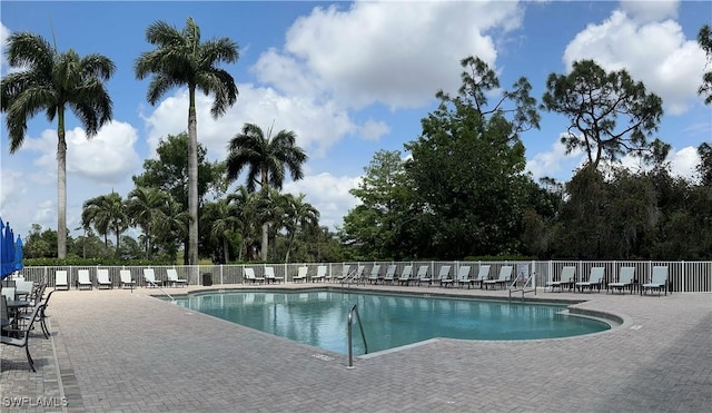 view of swimming pool with a patio area