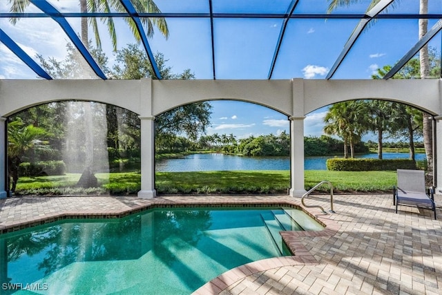 view of pool with a lanai, a water view, and a patio