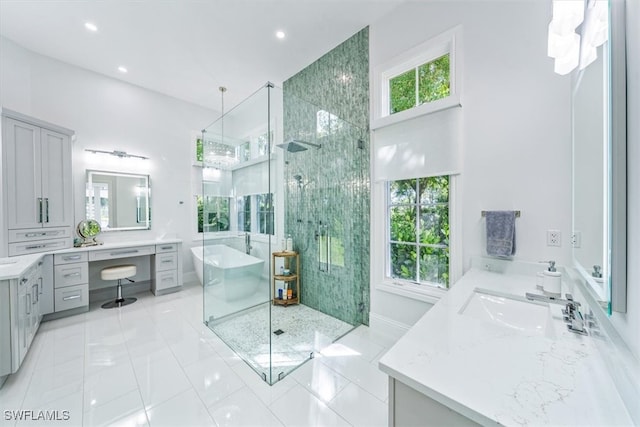 bathroom featuring vanity, plenty of natural light, and plus walk in shower