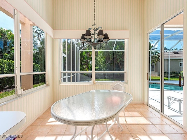 unfurnished sunroom featuring a wealth of natural light and a notable chandelier