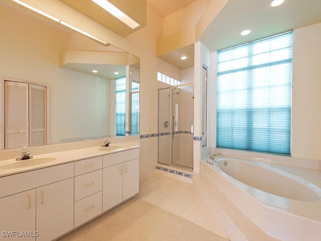 bathroom featuring vanity, separate shower and tub, and tile patterned floors