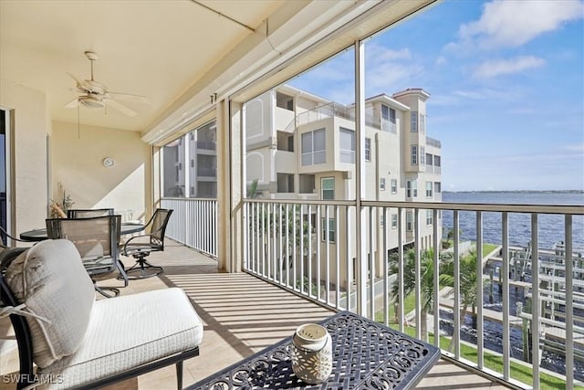 4235 SE 20th Pl Unit C302, Cape Coral, FL 33904 - balcony with a water view, a ceiling fan, and outdoor dining space