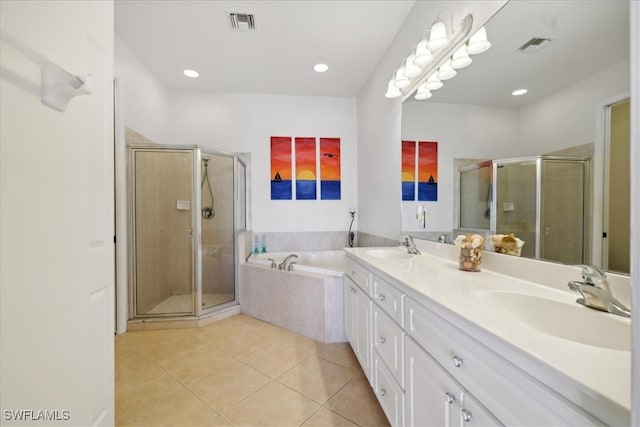 bathroom featuring tile patterned floors, vanity, and independent shower and bath