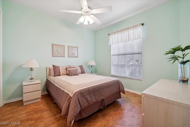 bedroom featuring ceiling fan and hardwood / wood-style floors