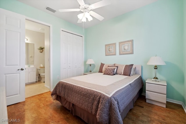 carpeted bedroom featuring connected bathroom, a closet, and ceiling fan