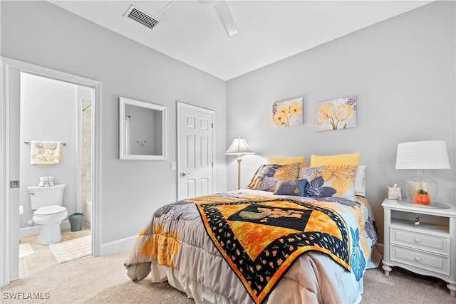 carpeted bedroom with connected bathroom and ceiling fan