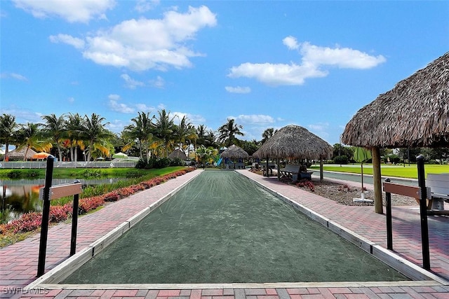 surrounding community featuring a gazebo and a water view