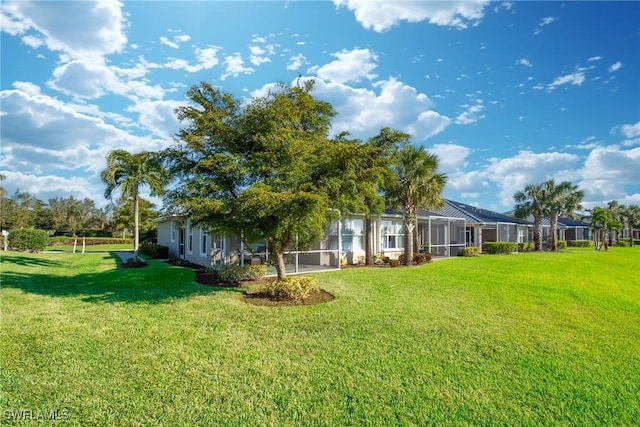 view of yard with a lanai