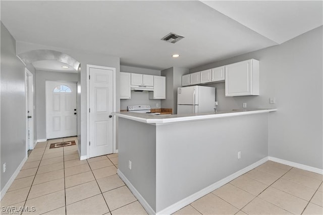 kitchen featuring kitchen peninsula, white cabinetry, light tile patterned floors, and white appliances