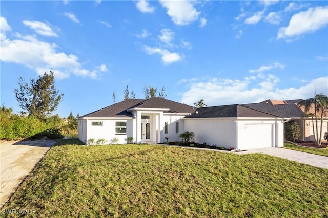 view of front of property with a front yard, concrete driveway, an attached garage, and stucco siding