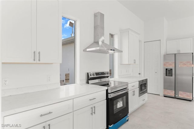 kitchen featuring exhaust hood, light stone countertops, white cabinets, and stainless steel appliances