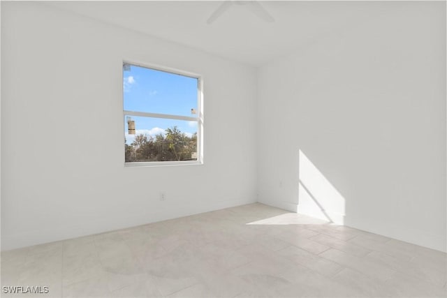 unfurnished room featuring a ceiling fan