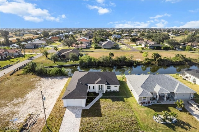 aerial view featuring a water view and a residential view