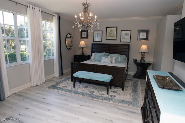 bedroom featuring crown molding, a notable chandelier, and light wood-type flooring