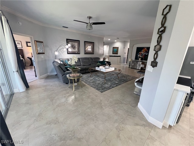 living room featuring ornamental molding and ceiling fan