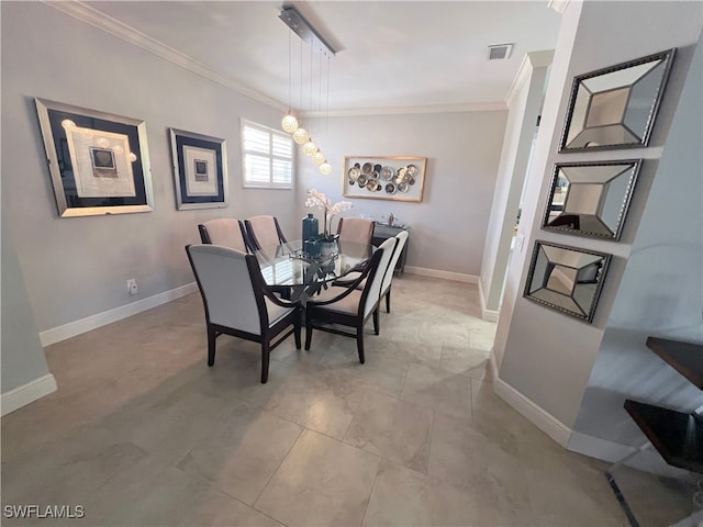 dining space with ornamental molding