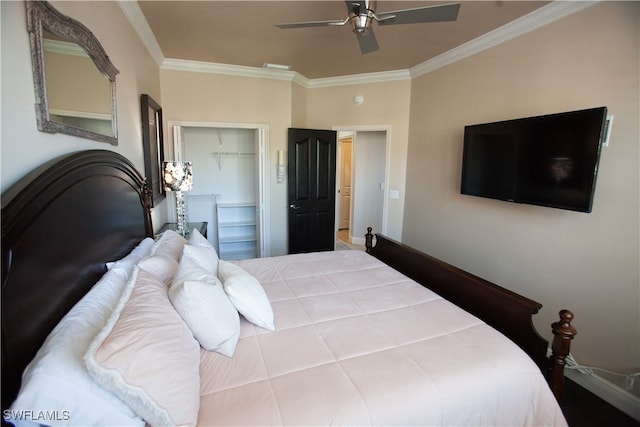 bedroom with ornamental molding, ceiling fan, and a closet