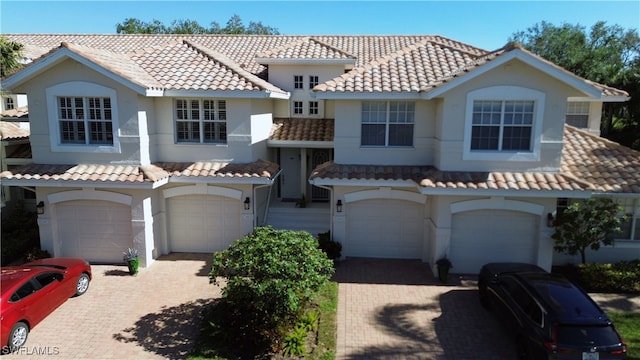 mediterranean / spanish-style house featuring a garage