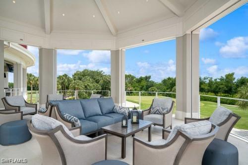 sunroom / solarium with a wealth of natural light and beam ceiling