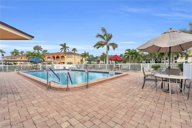 view of swimming pool featuring a patio area