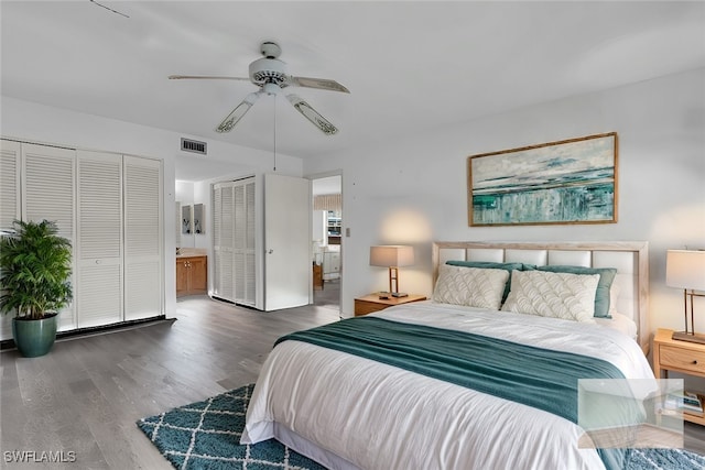 bedroom with connected bathroom, dark hardwood / wood-style floors, and ceiling fan