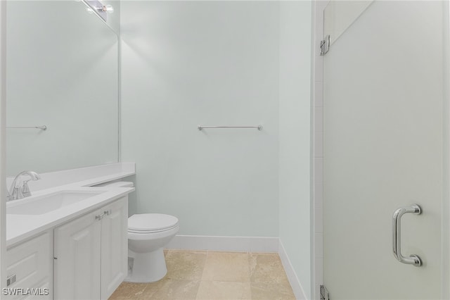 bathroom with walk in shower, vanity, and toilet