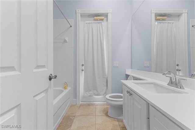 bathroom featuring tile patterned floors, vanity, and toilet