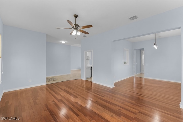 spare room with ceiling fan and light hardwood / wood-style flooring