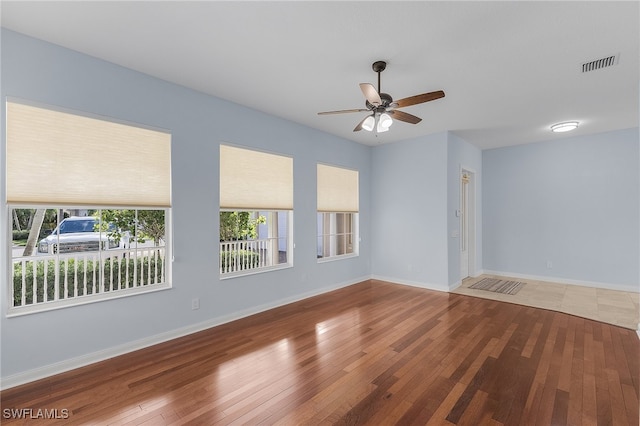 spare room featuring ceiling fan and wood-type flooring