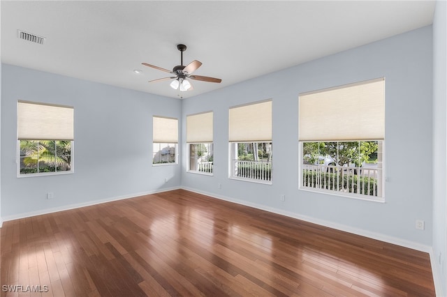 spare room featuring hardwood / wood-style flooring and ceiling fan