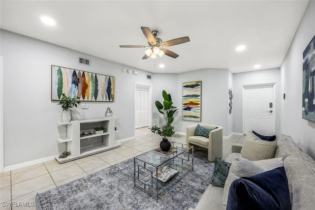 tiled living room with ceiling fan