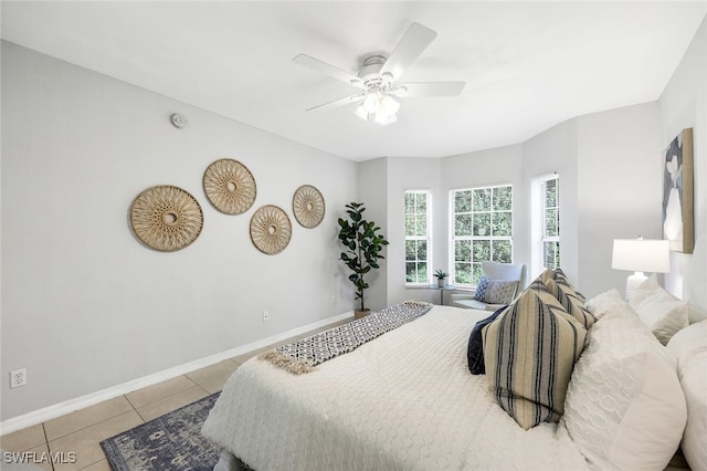 bedroom featuring ceiling fan and light tile patterned flooring