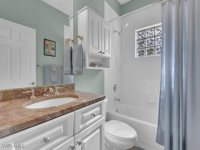 full bathroom with vanity, toilet, and shower / tub combo