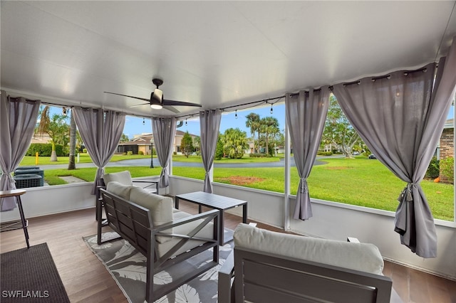 sunroom featuring plenty of natural light and ceiling fan