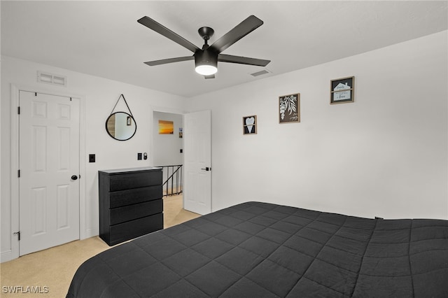 bedroom featuring ceiling fan and light colored carpet